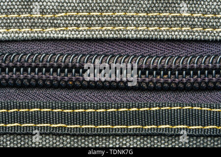 Zipper in gray sports backpack. Sports bag accessories background Stock Photo