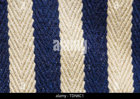 Herringbone tweed background with close up on fabric texture. Striped blue and white material Stock Photo