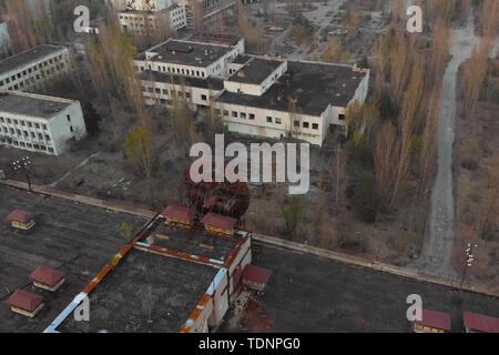 Pripyat aerial panorama cityview over the sign of USSR on the roof of building. Drone flies over the deserted abandoned city of Pripyat, Ukraine. Excl Stock Photo