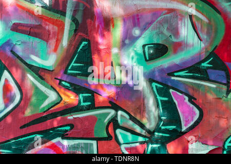 Abstract beautiful street art colorful graffiti style closeup. Detail of a wall. Can be useful for backgrounds. Modern iconic urban culture youth Stock Photo