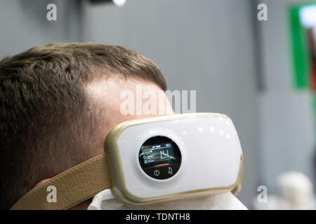 Relax and massage, electric eye massager on the concept of men, closeup. Display Stock Photo