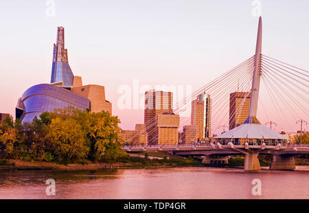 Winnipeg skyline from St. Boniface showing the Red River, Esplanade Riel Bridge and Canadian Museum for Human Rights; Winnipeg, Manitoba, Canada Stock Photo