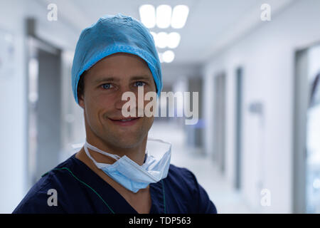 Male surgeon standing in the corridor at hospital Stock Photo