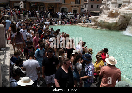 ROME, ITALY - JUNE 15 2019 - Tourist taking selfie at Fontana di Trevi fountain on sunny day Stock Photo