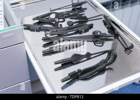 Unnatural medical instruments and accessories for virtual surgery. Plastic forceps, clamps, medical devices for 3D operations. Education of medical un Stock Photo