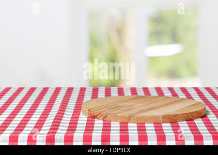 Wooden board with a napkin on a table Stock Photo