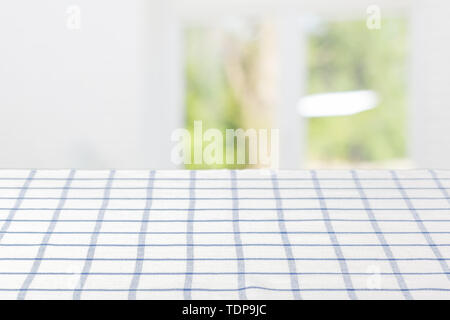 table covered with checkered tablecloth Stock Photo