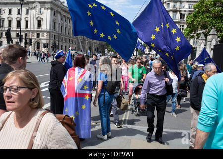 Anti Brexit protesters waving European Union flags in Westminster as inside Parliament the Tory leadership race continues on 17th June 2019 in London, England, United Kingdom. Stock Photo