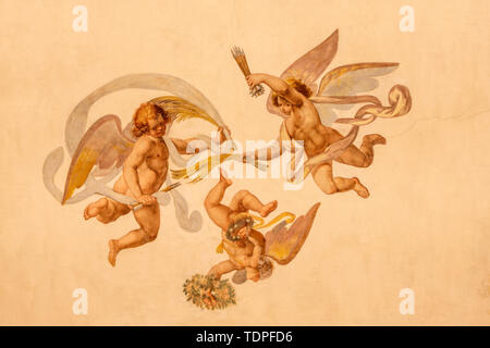 COMO, ITALY - MAY 11, 2015: The detail of baroque fresco of angels with the  instruments of martyrium in church Chiesa di San Orsola. Stock Photo