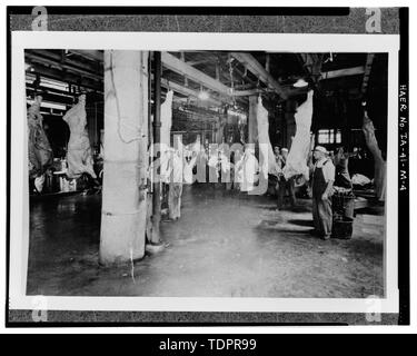 Photographic copy of photograph dated ca. 1940; Photographer unknown; Original in Rath collection at Grout Museum, Waterloo, Iowa; Filed under- Rath Packing Company, Box 49; SPLITTING CARCASSES WITH CLEAVER IN OLD BEEF HOUSE - Rath Packing Company, Cooler Building-1929 Beef House, Sycamore Street between Elm and Eighteenth Streets, Waterloo, Black Hawk County, IA Stock Photo