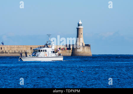 Pier with lighthouse and boat on the River Tyne; South Shields, Tyne and Wear, England Stock Photo