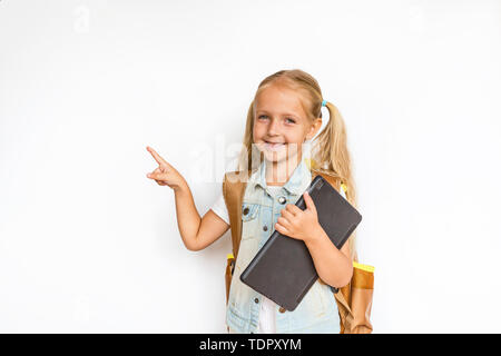 Back to school and happy time. Cute child on white background. Kid with backpack. Girl ready to study. Mockup, place for text Stock Photo