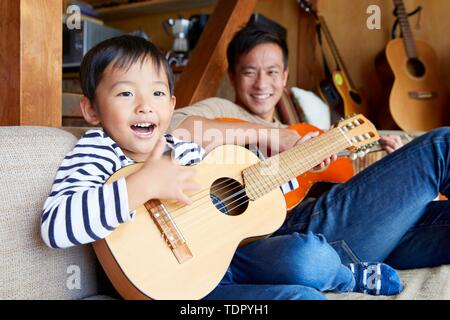Japanese kid with father at home Stock Photo