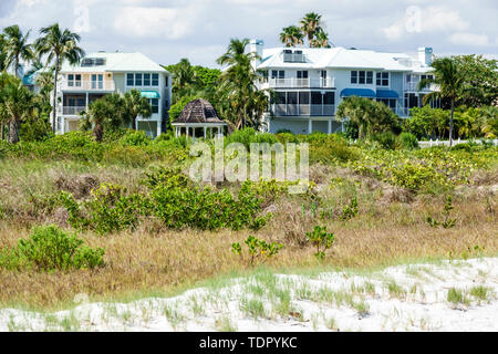 Sanibel Island Florida,East Gulf Drive,oceanfront beachfront homes,large single-family houses,multi-story,dune,grasses,visitors travel traveling tour Stock Photo