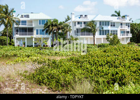 Sanibel Island Florida,East Gulf Drive,oceanfront beachfront homes,large single-family houses,multi-story,dune,grasses,visitors travel traveling tour Stock Photo