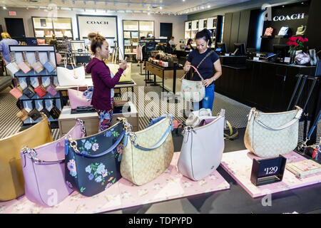 Coach handbags on display at the Coach boutique within Macy's in New York  on Tuesday, August 4, 2015. A tractor trailer containing $500,000 worth of  Coach handbags was stolen from the SalSon