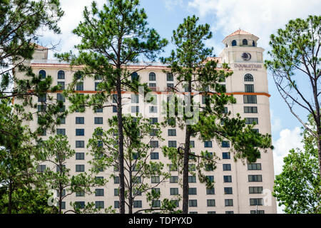 Orlando Florida,Doubletree by Hilton Hotel Orlando at SeaWorld,hotel,building exterior,high-rise,pine trees,FL190512006 Stock Photo
