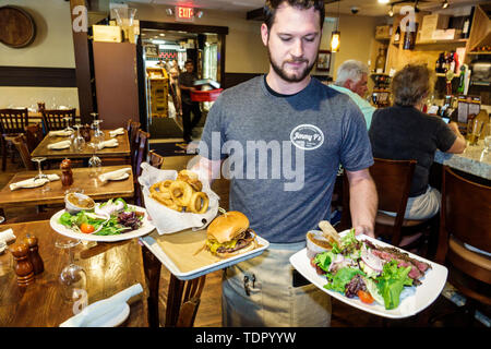 Naples Florida,Jimmy P's Butcher Shop & Deli Charred Steakhouse,restaurant restaurants food dining cafe cafes,man men male,waiter waiters server emplo Stock Photo