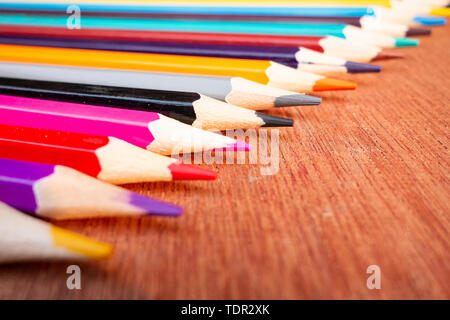 A neatly arranged colored pencil on the table. Stock Photo
