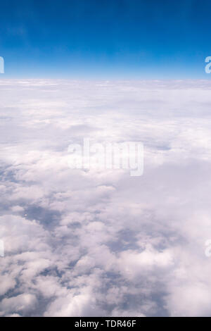 Shooting the sky above the clouds through the plane window Stock Photo ...