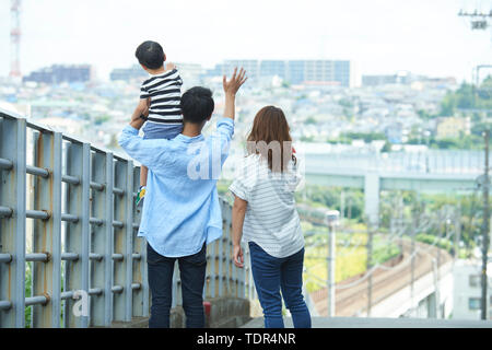 Japanese family outdoors Stock Photo