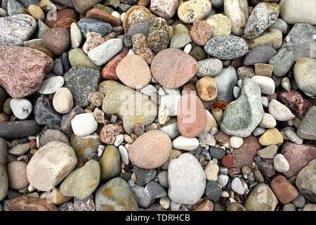 Decorative Round Stones, Abstract Smooth Round Pebbles on a Beach, Pebbles Sea Texture Background, Ocean Wet Stones, Multicolored Pebbles, Sea shore,  Stock Photo