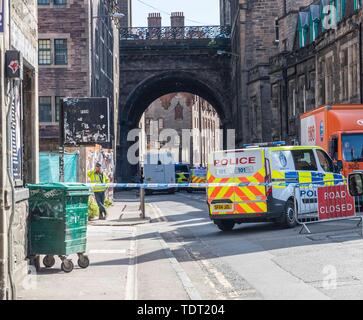 Edinburgh, Scotland, UK. 18th June, 2019. Edinburgh's Cowgate has been c loser falling reports of an individual falling from the George IV bridge. Police and ambulance are in attendance. Credit: Rich Dyson/Alamy Live News Stock Photo