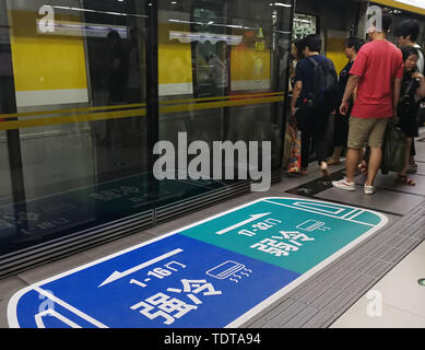 Beijing, Beijing, China. 19th June, 2019. Beijing, China - June 19 2019: -Beijing metro line 6 is trying different temperatures for the same train, from gate 1 to gate 16, blue strong cold zone, from gate 17 to gate 32, green weak cold zone.Beijing metro line 6 is experimenting with ''strong and weak cold air-conditioned carriages'' to further improve service quality and meet passengers' differentiated needs, according to the Beijing Subway Corporation.Passengers can take the bus according to the signs posted on the ground of the platform. Credit: SIPA Asia/ZUMA Wire/Alamy Live News Stock Photo