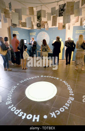 Rostock, Germany. 19th June, 2019. Steffen Stuth (M), Museum Director, presents the new exhibition 'People - Knowledge - Life Paths' at a press event in the Monastery of the Holy Cross. The name 'Hotspot Rostock' is projected onto the floor. From 20.06.2019 the show will present aspects from 600 years of Rostock university and science history. Credit: Bernd Wüstneck/dpa-Zentralbild/dpa/Alamy Live News Stock Photo