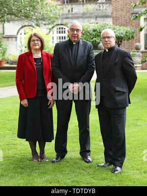 Outgoing Dean of Westminster, The Very Reverend Dr John Hall (centre), who retires on November 1, after 13 years at Westminster Abbey, with the Very Reverend Dr David Hoyle - who has been appointed the new Dean of Westminster, and will be installed on November 16 - with his wife Janet during a photo call at Westminster Abbey, London. Stock Photo