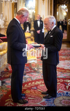 The Prince of Wales presents designer Ralph Lauren with his honorary KBE (Knight Commander of the Order of the British Empire) for Services to Fashion in a private ceremony at Buckingham Palace. Stock Photo