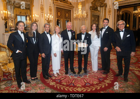 The Prince of Wales (centre) presents designer Ralph Lauren (fourth right) with his honorary KBE (Knight Commander of the Order of the British Empire) for Services to Fashion in a private ceremony at Buckingham Palace. Stock Photo