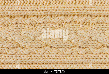Dark Yellow Knitting Texture or Knitted Texture Background in macro style. Knitting Texture or Knitted Texture in vintage style for design Stock Photo
