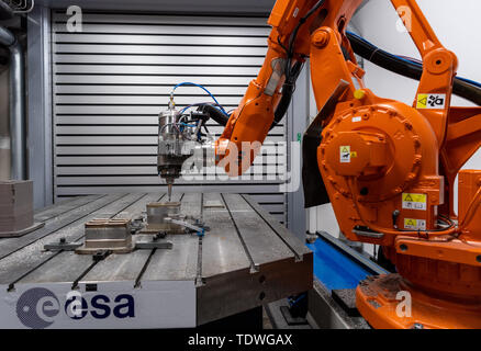 Dresden, Germany. 03rd Apr, 2019. A milling robot in the Additive Manufacturing Center Dresden (AMCD) of the Fraunhofer Institute for Material and Beam Technology IWS uses 3D printing to process a section of an optical bench, which is to be used on an ESA mission into space in 2028. Credit: Robert Michael/dpa-Zentralbild/ZB/dpa/Alamy Live News Stock Photo