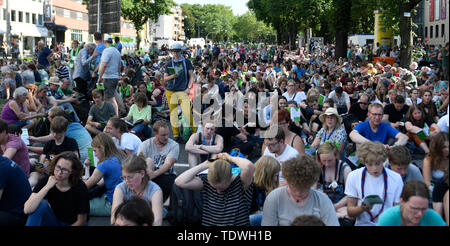 Dortmund, Germany. 19th June, 2019. Believers are sitting on the street at the opening event of the German Protestant Church Congress. The 37th Gospel Kirchentag takes place from 19 to 23 June. Credit: Bernd Thissen/dpa/Alamy Live News Stock Photo