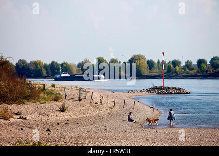 people and cargo ship on Rhine river, Germany, North Rhine-Westphalia, Ruhr Area, Wesel Stock Photo