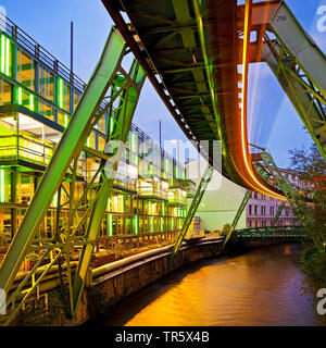 light streak of monorail suspension of Wuppertal over river Wupper in the evening, Germany, North Rhine-Westphalia, Bergisches Land, Wuppertal Stock Photo