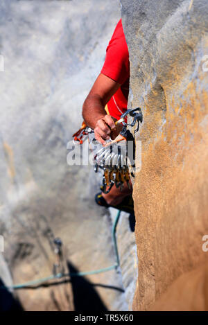 climber belaying with snap hook at rock wall, France, Provence, Canyon Du Verdon Stock Photo