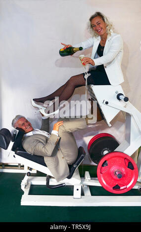 pair celebrating silver wedding anniversary with sport and sekt Stock Photo