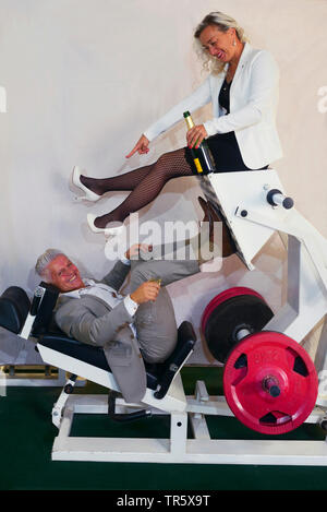 pair celebrating silver wedding anniversary with sport and sekt Stock Photo