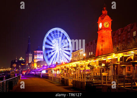 Rhine Promenade with illuminated flood marker and ferris wheel in the evening , Germany, North Rhine-Westphalia, Duesseldorf Stock Photo