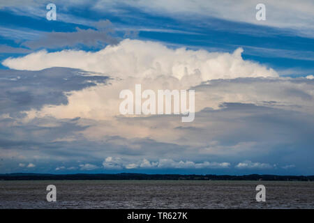 Cumulonimbus capillatus, seems threatening over the lake, Germany, Bavaria, Lake Chiemsee Stock Photo