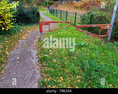 foot path passing a barrier, Germany, North Rhine-Westphalia Stock Photo
