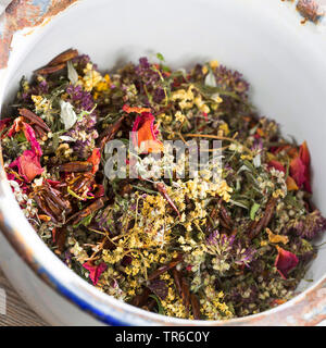 dried herbs in a bowl for making a curing bullets, Germany Stock Photo