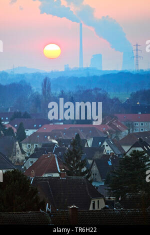 residential area and Bergkamen power station at sunset, Germany, North Rhine-Westphalia, Ruhr Area, Hamm Stock Photo