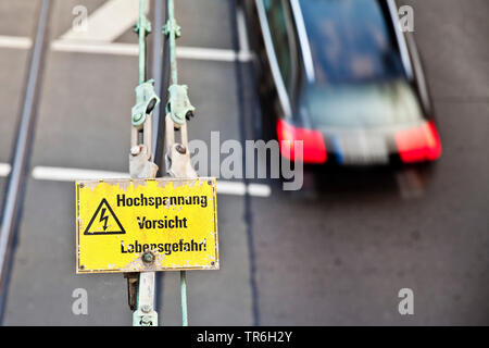 contact wire and warning sign 'high voltage, caution, danger of life', Germany, North Rhine-Westphalia, Duesseldorf Stock Photo