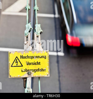 contact wire and warning sign 'high voltage, caution, danger of life', Germany, North Rhine-Westphalia, Duesseldorf Stock Photo