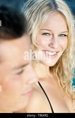young couple relaxing at a pool, Germany Stock Photo