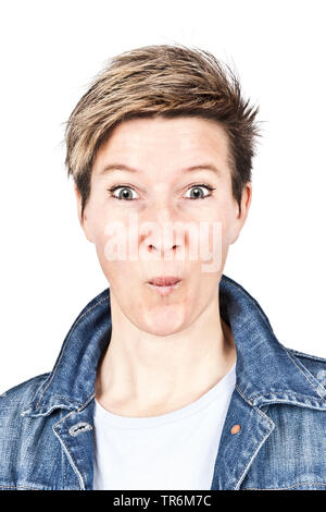 beautiful woman with short hair being amazed, Germany Stock Photo