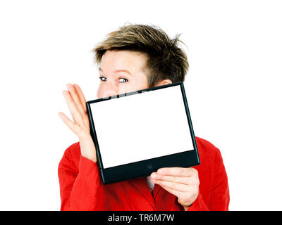 shorthaired woman presenting a blank screen, Germany Stock Photo